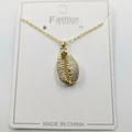 Golden shell pendant necklace with sparkling cubic zirconia on a minimalist chain - Conch Pendant with Chain and Packaging
