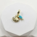 Gold ocean pendant with blue fish tail, seashell, and zircon on white display stand - Whale Shell Pendant