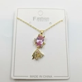 Gold fish pendant necklace featuring a pink teardrop crystal and white zircon accents - Pink Goldfish Pendant With Chain And Packaging