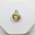 Golden shell pendant with blue enamel and a white pearl on a white pedestal - Shell Style 1