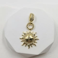 Elegant gold sun pendant necklace with sparkling zircon accents and radial design - Sun Charm