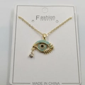 Gold evil eye necklace with blue accents and teardrop zircon on a white card - Waterdrop Pendant Style I / Pendant And Chain With Packaging