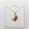 Golden crab pendant necklace featuring a red center stone and clear zircon accents - Red Small Crab Pendant + Chain + Packaging