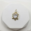 Gold sea turtle pendant with a large oval zircon and pavé crystal shell on a white stand - White Zirconia Turtle Pendant