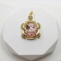 Golden sea turtle pendant featuring a large faceted pink gemstone and white zircon accents - Pink Zirconia Turtle Pendant