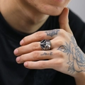 Vintage gothic skull ring for men in antique silver finish on model's finger - US 7 / Steel