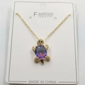 Golden turtle pendant necklace featuring a purple gradient stone and white crystals - Purple Zirconia Turtle Pendant + Chain + Packaging