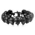 Detailed view of matte black skull links on a men's gothic titanium steel bracelet - Black