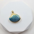 Seashell pendant with golden metal shell and blue enamel finish on white display stand - Shell Style 4