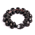 Bracciale teschio nero in acciaio inossidabile da uomo con occhi in gemma rossa - Base Nera Pietra Rossa