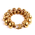 Bracciale da uomo a teschio in acciaio al titanio dorato con zirconi rossi negli occhi - Oro Rosso