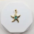 Golden starfish pendant featuring a teal center gemstone and dark accent stones - Starfish Style 1