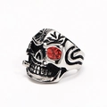 Macro detail of punk skull ring with red rhinestone eye and silver-tone metal texture - US 7 / Steel Red Zircon