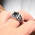 Close-up of Masonic compass and square symbol on silver stainless steel ring with black stone - Steel Base with Black Rhinestone