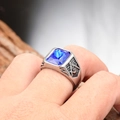 Macro shot of men's Masonic steel ring featuring a blue gemstone and side engraving - Steel Base with Blue Rhinestone