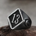 Macro shot of punk style stainless steel ring with number 13 and skull engravings - US 7 / Antique Silver