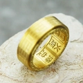 Close-up of gold rotatable Tai Chi ring showing interior lucky Chinese character engravings - US 7 / Gold