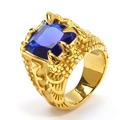 Macro view of gold eagle claw ring with rectangular blue gemstone and scale texture - Size 7 / Gold Blue Zirconia