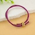 Bracciale intrecciato viola con dettagli dorati regolabili su base di pietra - Rosa Carminio