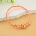 Bracciale regolabile in corda di pelle intrecciata arancione con fibbia in metallo dorato - arancione brillante