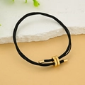 Bracciale in pelle intrecciata nera con chiusura a infinito dorata e punte in metallo - Nero