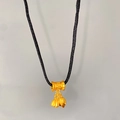 Detail of gold lotus seed pod pendant necklace with black cord in Chinese style - Lulutong Lotus Pod (X2194)