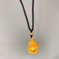 Macro view of gold lotus gourd pendant with intricate star patterns and decorative bow tie - Star Pattern Bow Gourd (X2185)