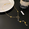Detail of 18K gold-plated Y-necklace with tassels and sparkling cubic zirconia stones - Geometric Round Style Gold (X1139-1)