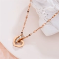Rose gold heart pendant necklace with shimmering zircon rings on white artistic stone - Heart Circle Zirconia (Lip Chain) / Rose Gold