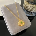 Golden locket necklace with clover design and micro-set cubic zirconia crystals - Round Clover Locket (W891)