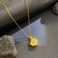Gold locket necklace with green gemstone and white zircon flower pendant on black base - Round Blue Zirconia Flower