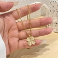 Golden clover pendant necklace with white cat eye stones and central crystal inlay - Gold Cat's Eye Clover (Box Chain)