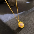 Golden oval locket necklace with yellow enamel, purple flower and pearl on black background - Bright Yellow Floral Pearl (W1046)