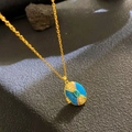 Vintage locket necklace with blue enamel and green stone in golden finish - Lake Blue Enamel Green Stone (W1051)