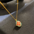 Golden necklace with mint green enamel locket featuring a red floral pearl design - Pale Green Enamel Red Star (W1056)