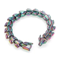 Macro shot of punk dragon head steel bracelet with colorful iridescent plated finish - Rainbow