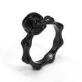 Detailed view of punk style black stainless steel skull and crossbones ring for men - US 5 / Black