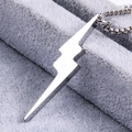 Macro detail of a high-polished lightning bolt pendant with a sturdy steel box chain - Silver Tone (Pendant Only)