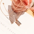 Elegante rotgoldene Abakus-Halskette mit beweglichen Perlen an einer feinen Kette - Roségold Abakus