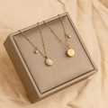 Gold titanium necklace with round cat's eye stone and 'Fu' character charm on satin - Cat's Eye Double Sided Lucky Necklace