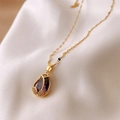 Elegant gold tulip necklace featuring a pear-shaped purple gemstone with pavé diamonds - Purple Tulip (Lip Chain) / Gold