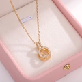 Golden geometric pendant necklace with dancing cubic zirconia on a pink jewelry box - Gold Small Moving Pendant (O-Chain)