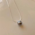 Minimalist silver chain necklace featuring a glossy dark grey round pearl pendant - Gold-Grey Pearl