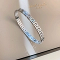 Polished silver titanium steel bangle featuring a classic Greek key relief pattern - Greek Key Bracelet / Silver
