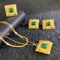 Macro view of vintage gold layered necklace and ring set with emerald green stones - Wrinkled Texture Square Gem Style (A524-1)