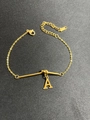 Detail of gold titanium steel knot bracelet with letter A pendant and lobster clasp closure - Letter A