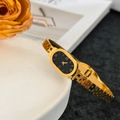 Vintage gold stainless steel watch bracelet with black oval dial and Greek key pattern - Roman Numeral Bangle (Gold)