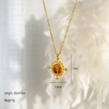 Vintage gold necklace with tiger eye stone pendant on white feather background - Cross Oval Style / Gold