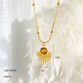 Macro view of sunburst pendant necklace with natural tiger eye stone and beaded gold chain - Fan Shape Style