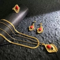 Close-up of vintage gold jewelry set featuring red stone necklaces, ring, and earrings - Vintage Red Stone Radiant Style (A525-1)